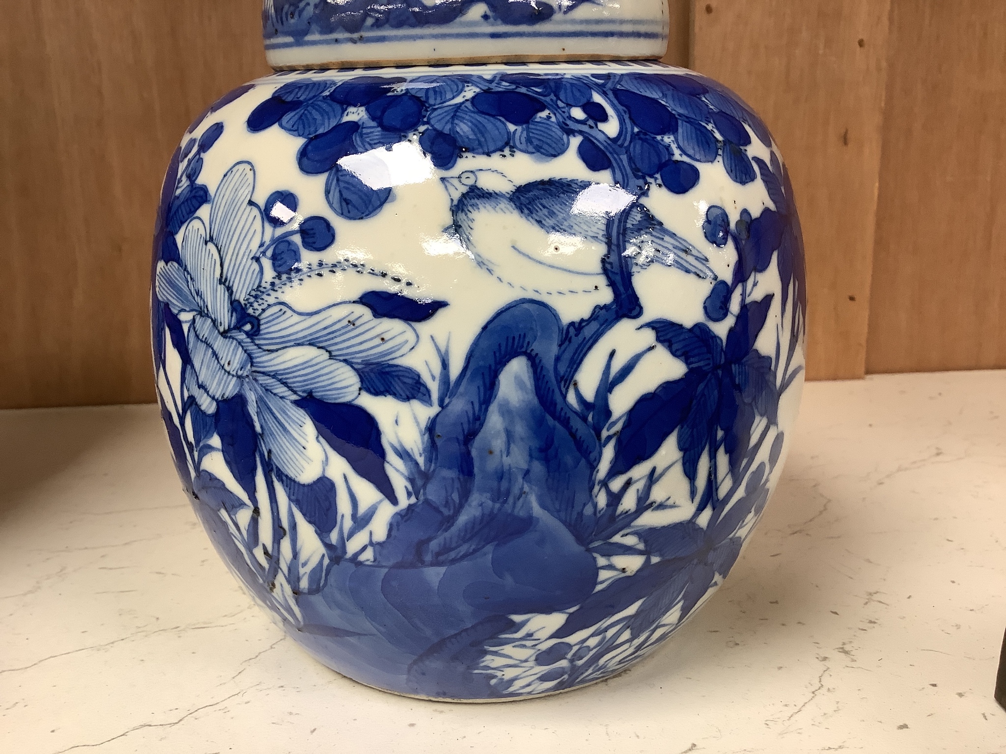 A Chinese blue and white 'birds and flowers' jar and cover, Kangxi mark, c.1900, height 15cm